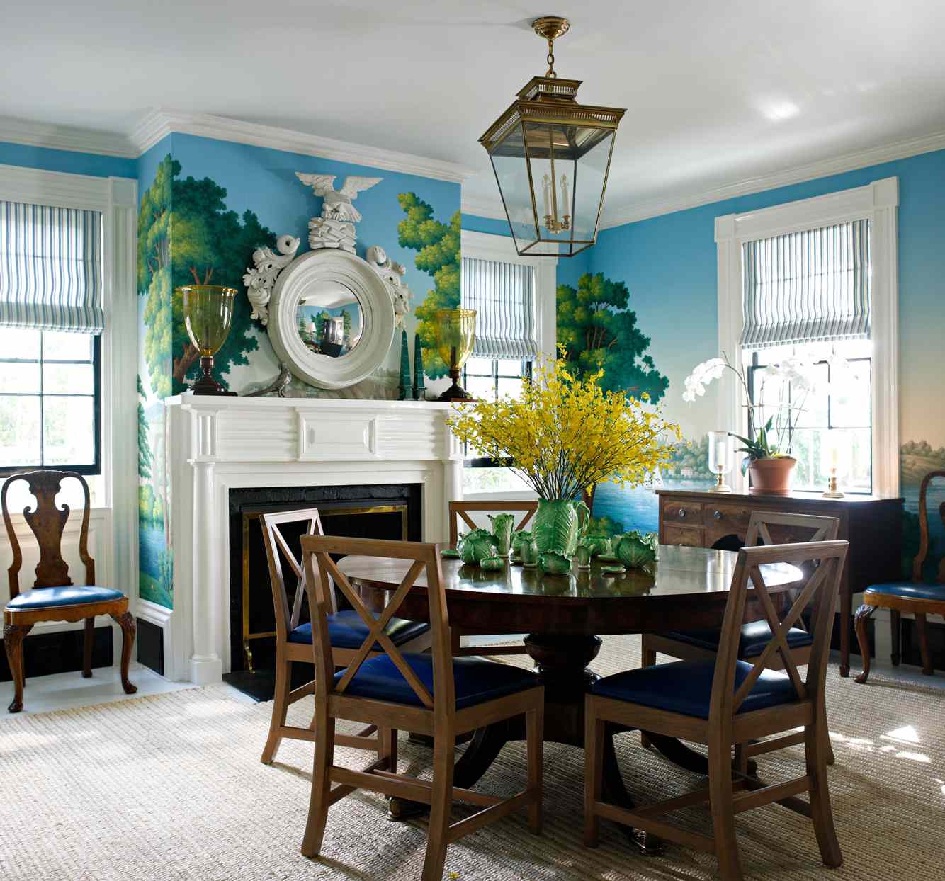 dining room with landscape mural fireplace