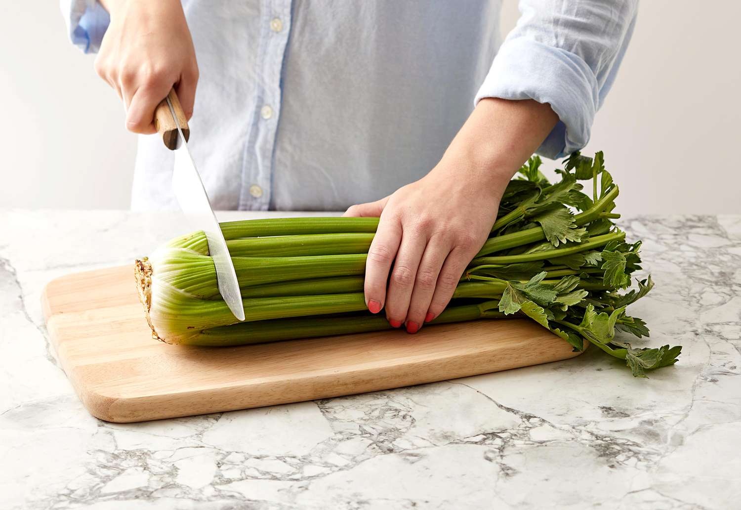 Person cutting celery end