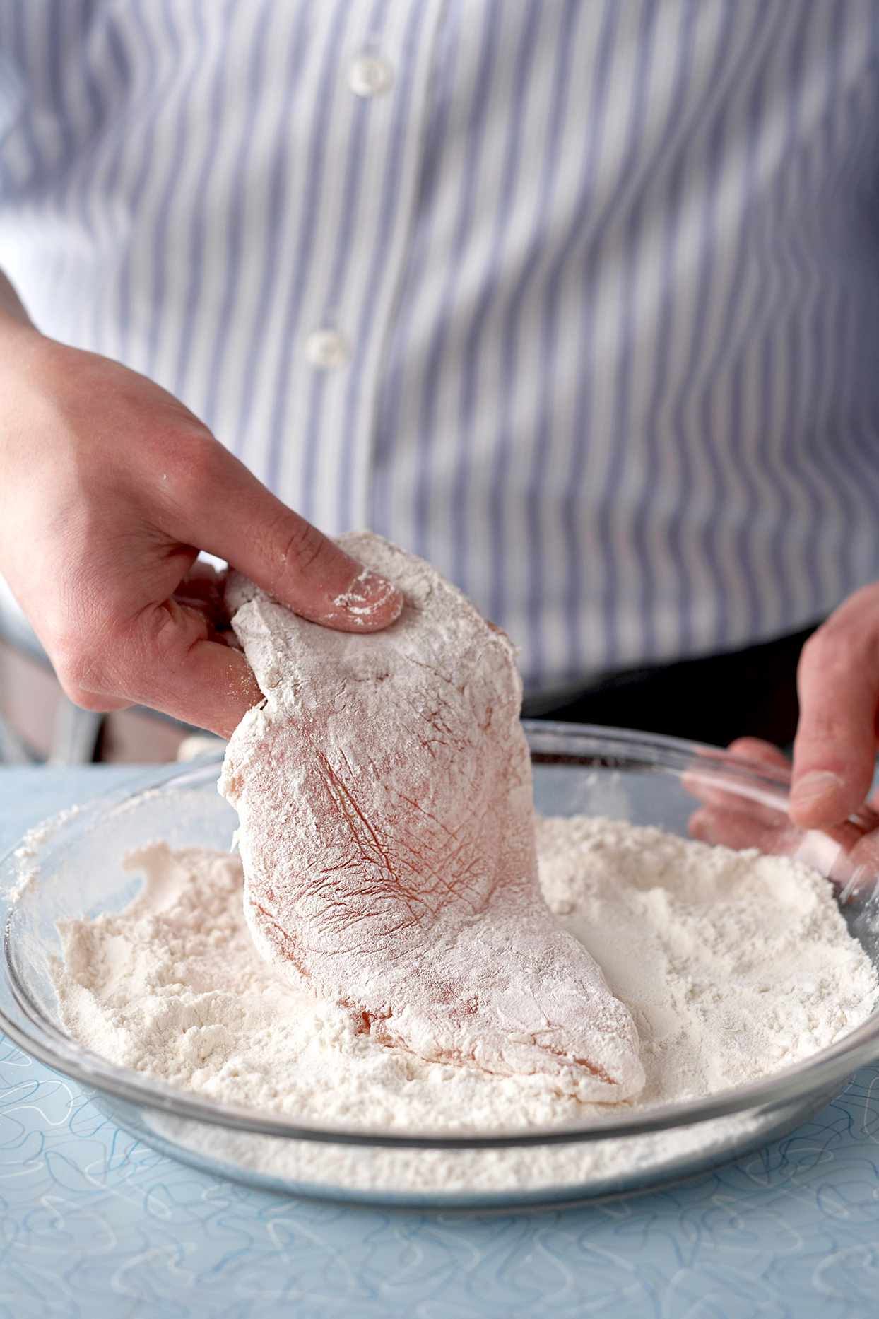Coating chicken breast in flour
