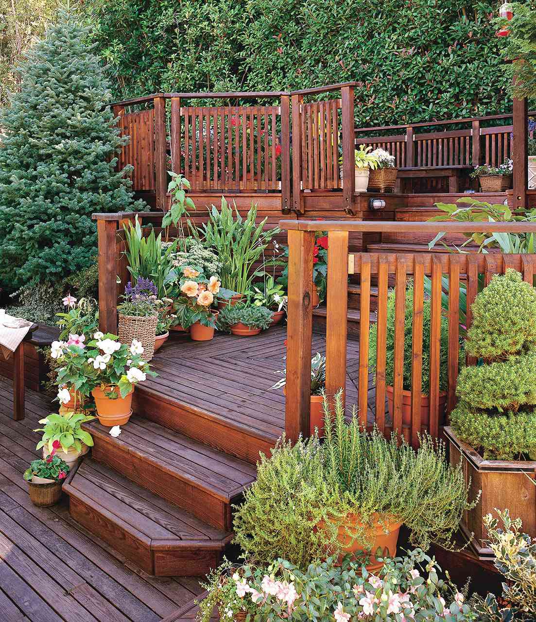 multi-level wood deck with potted plants