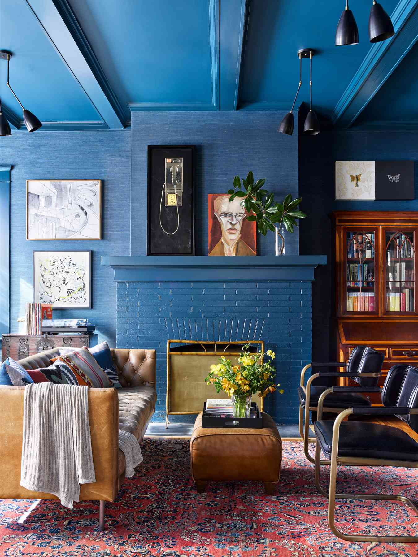 blue living room payphone art on fireplace mantel