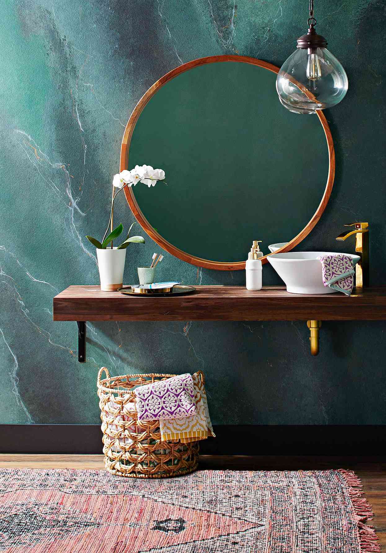 bohemian-style bathroom vanity with green marbled wall effect