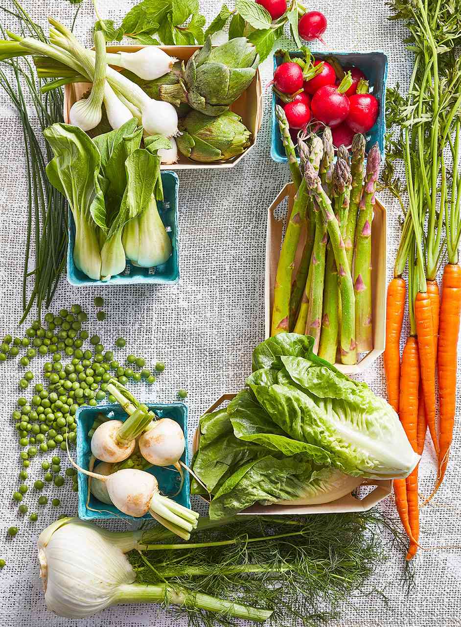 fresh spring vegetables in produce boxes