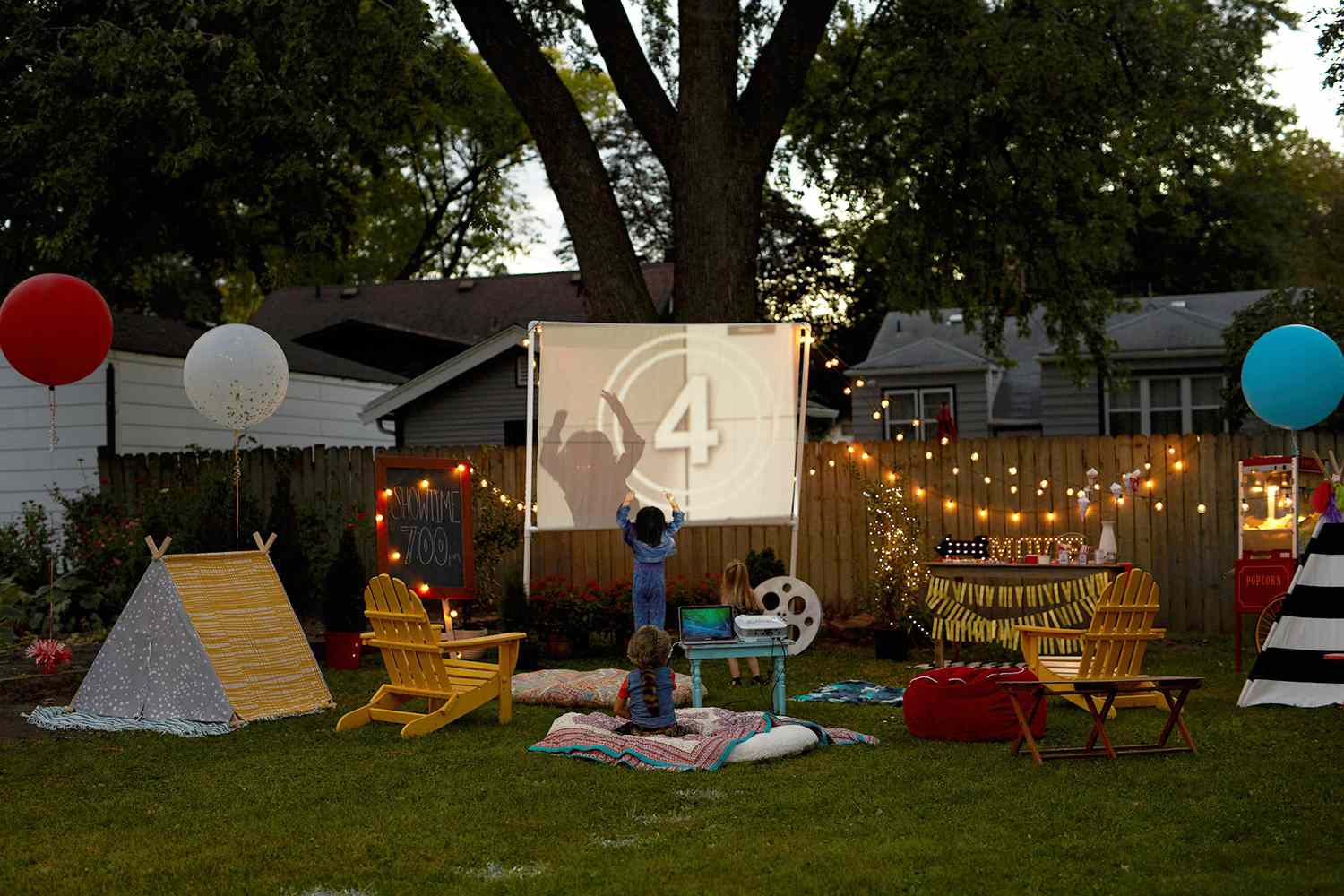 An outdoor movie setup in yard