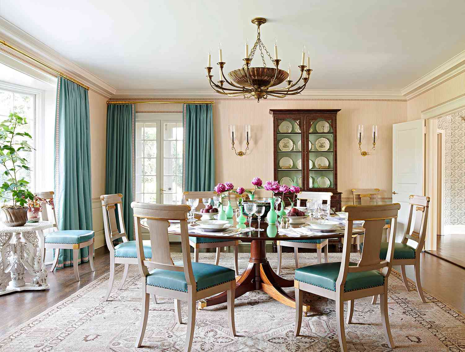 teal draperies in dining room with china cabinet