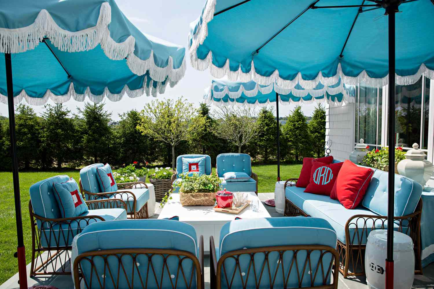 blue patio furniture and umbrellas