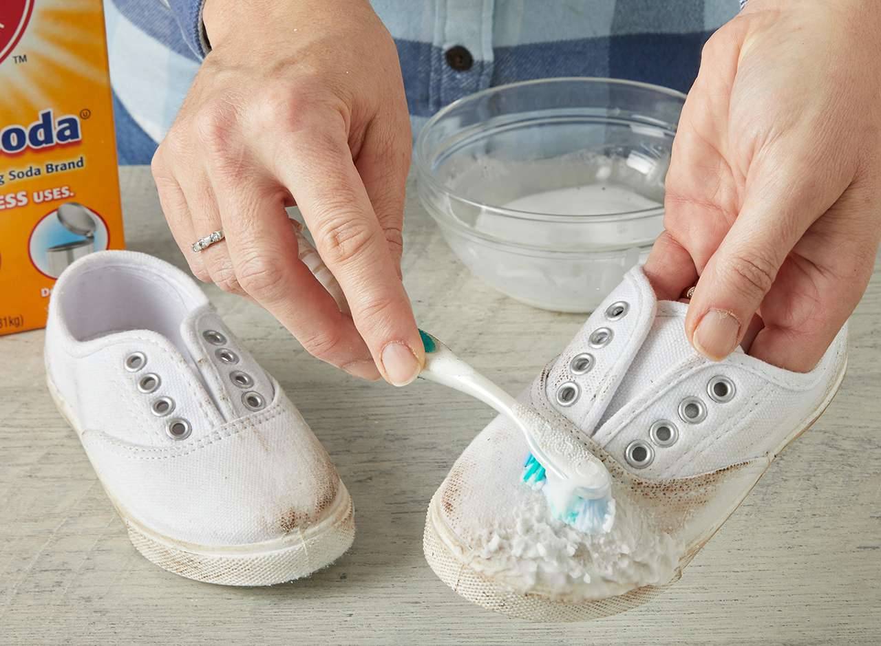 scrubbing shoe dirt toothbrush