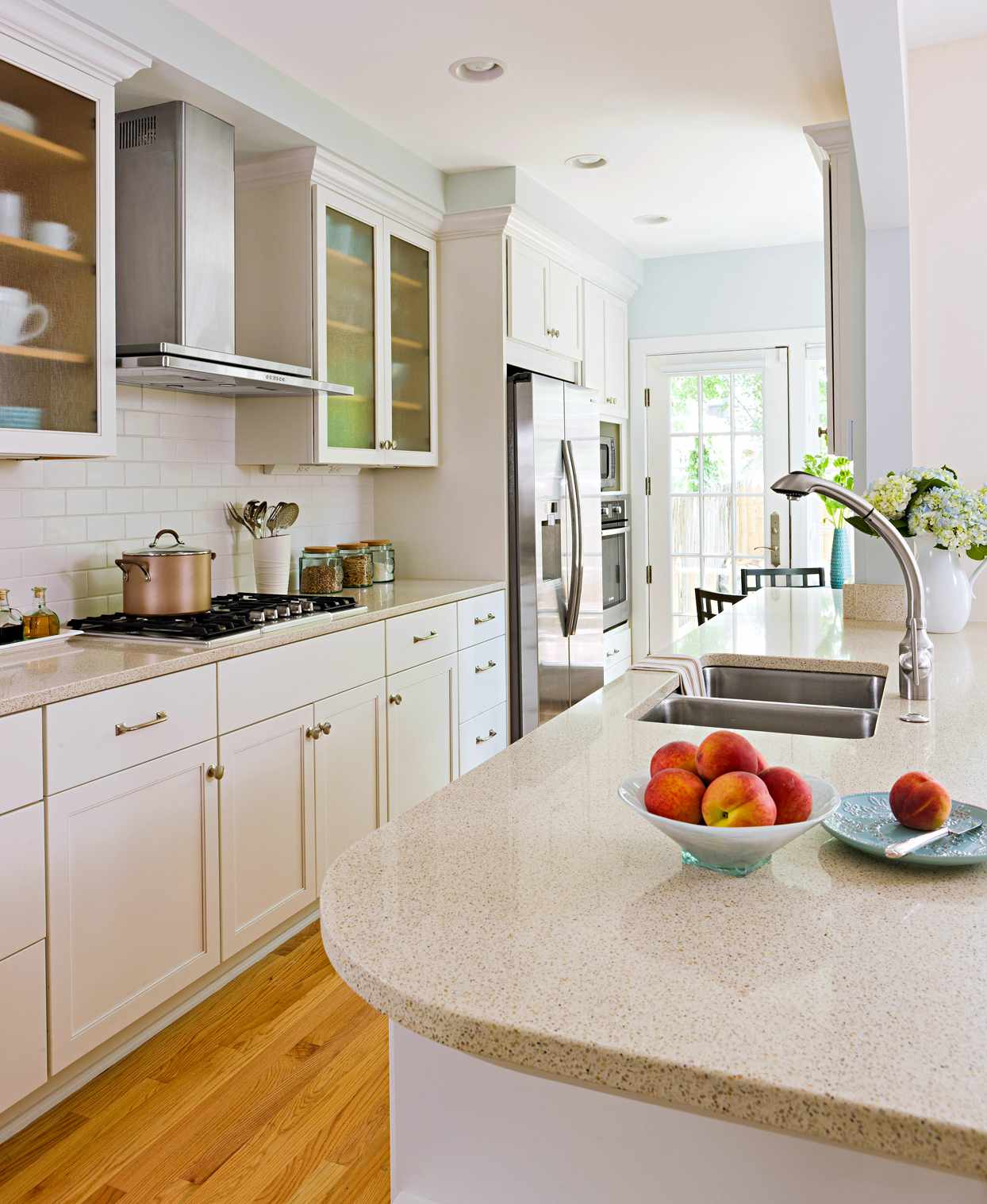 white kitchen with beige countertops