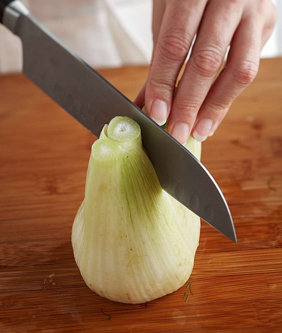 slicing fennel half