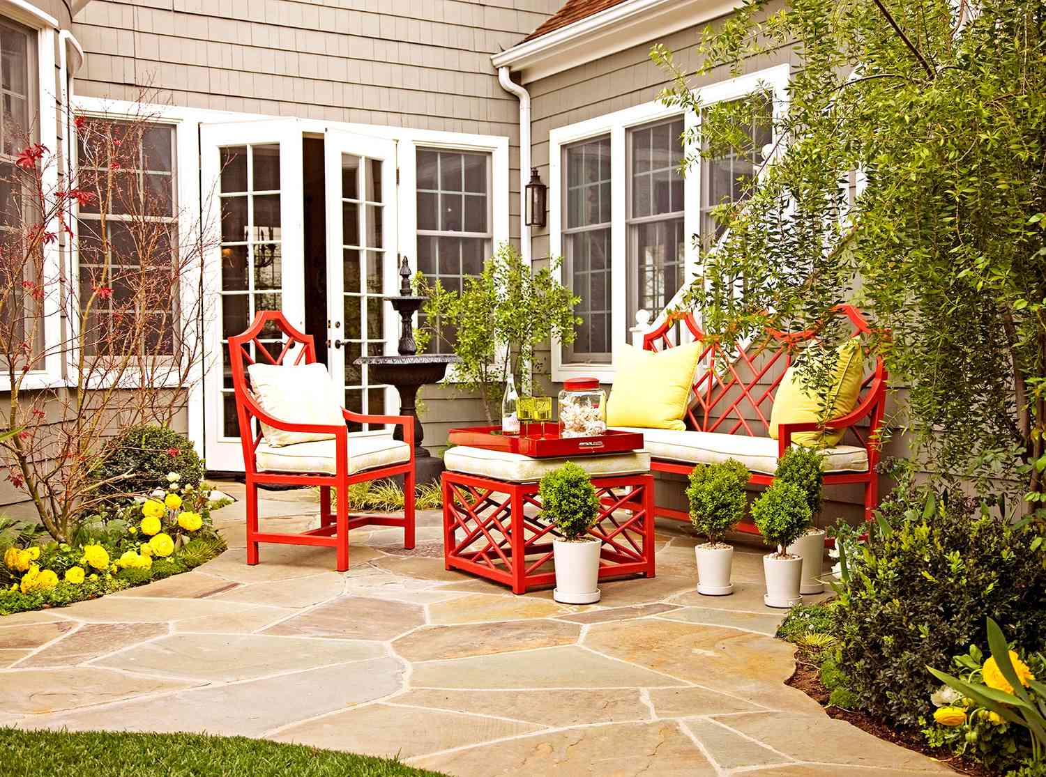 Outdoor seating with stone patio and red seating