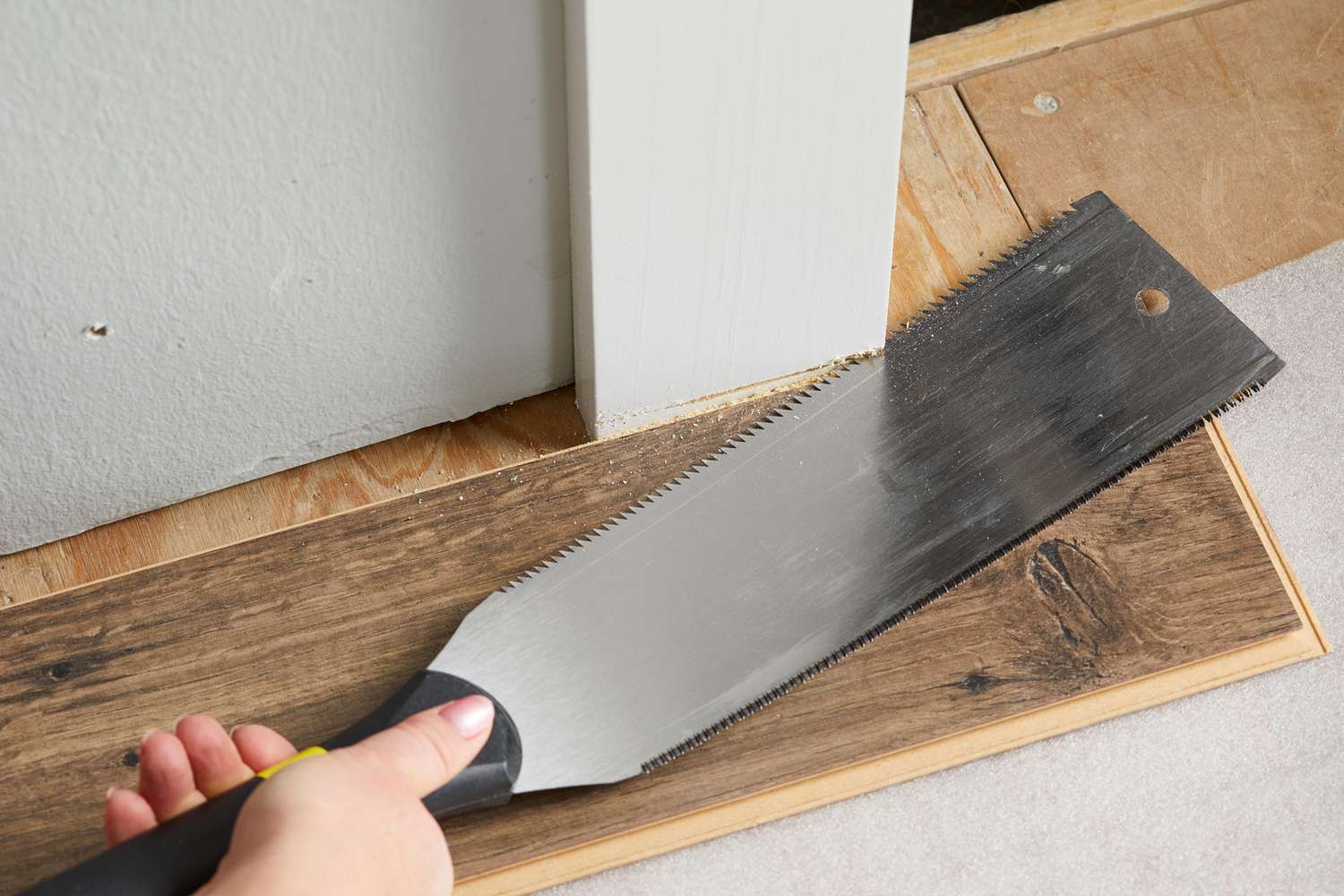 cutting white wood plank
