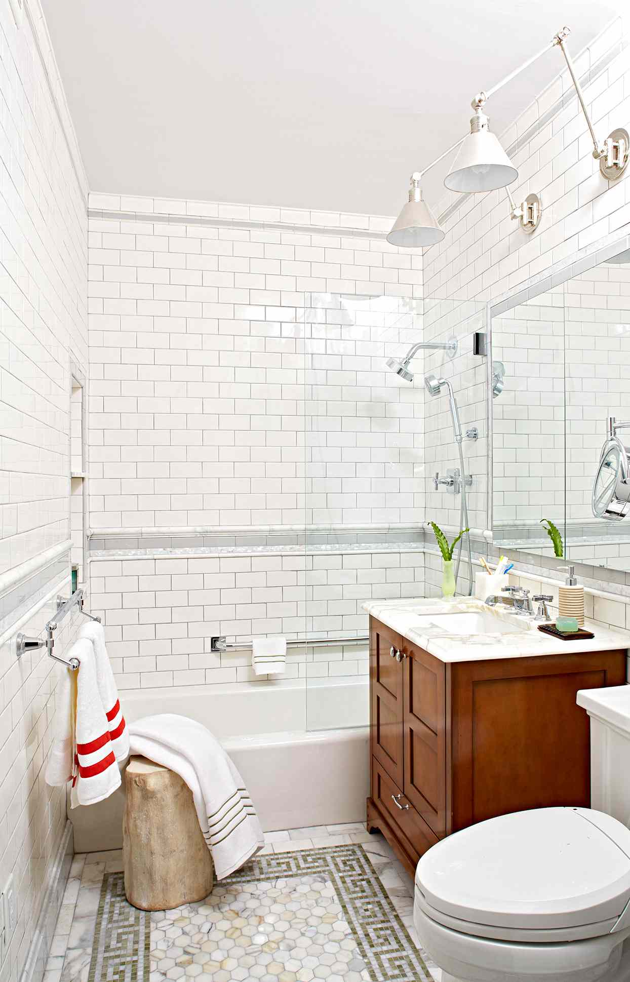 Bathroom with wooden cabinet and subway tile