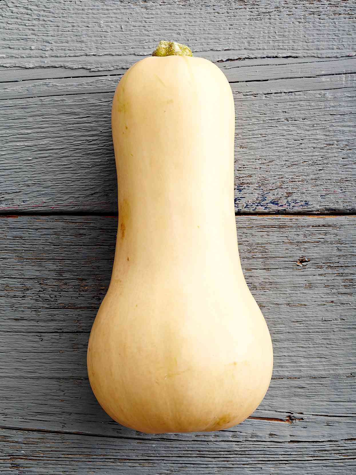 butternut squash on gray wood background