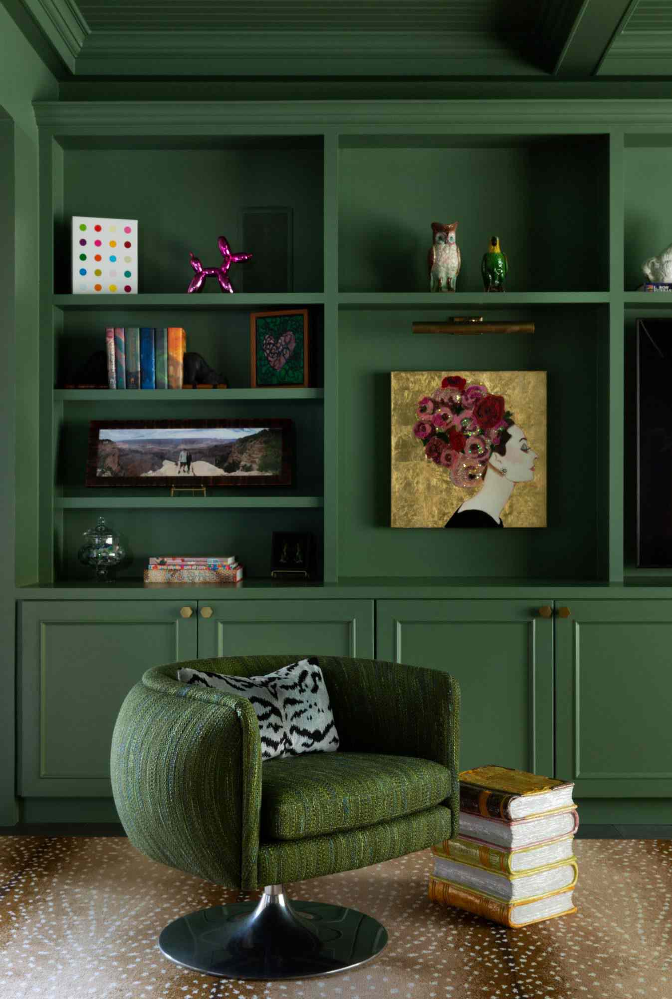 dark green painted library, sitting area