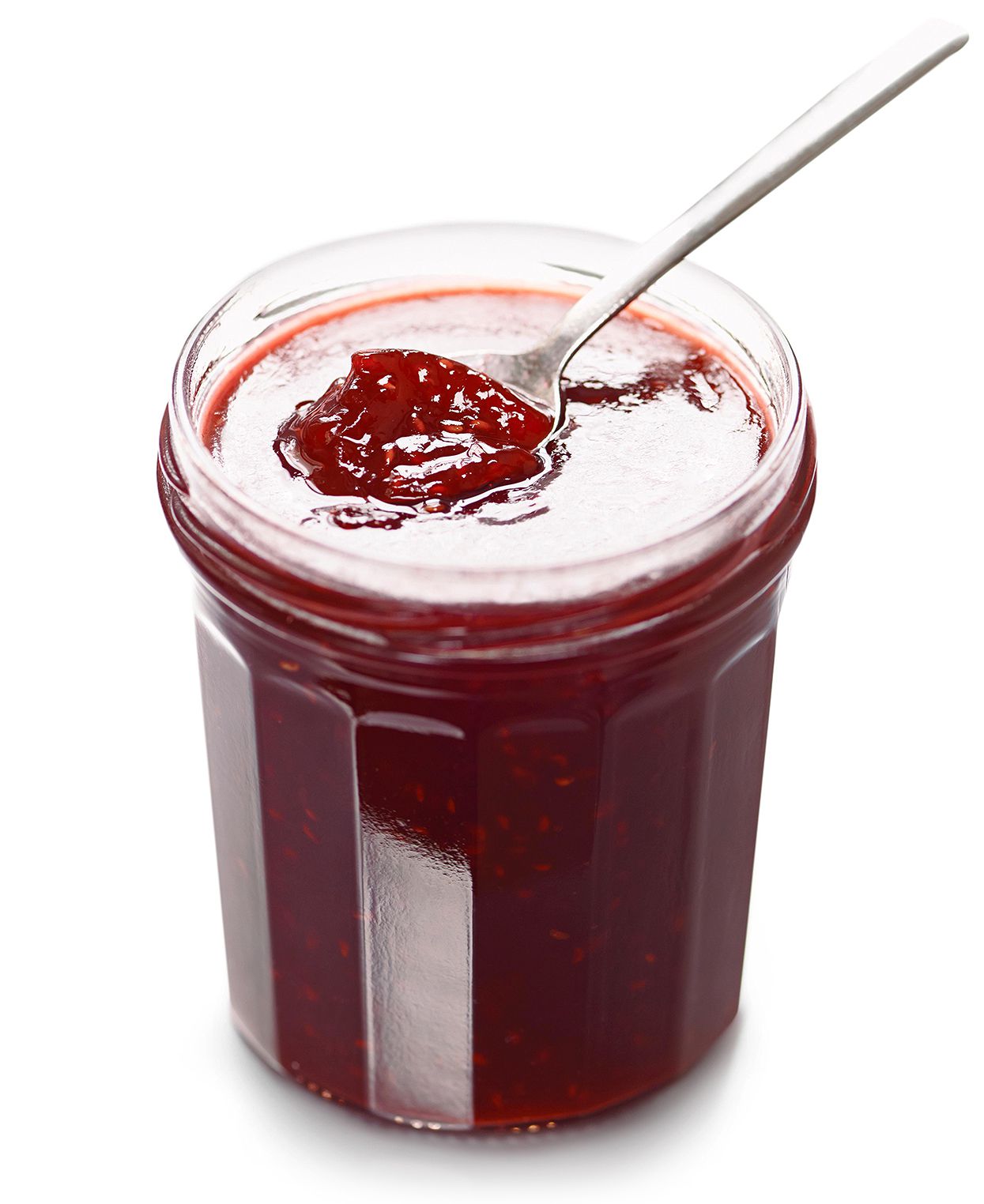 glass jar with red jam and spoon