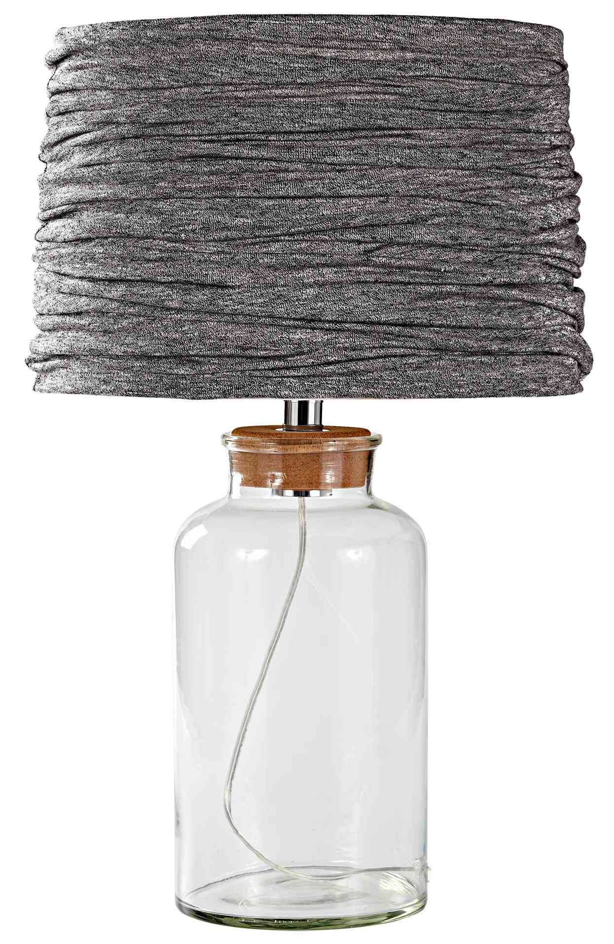 gray t-shirt dress wrapped around lampshade with glass base
