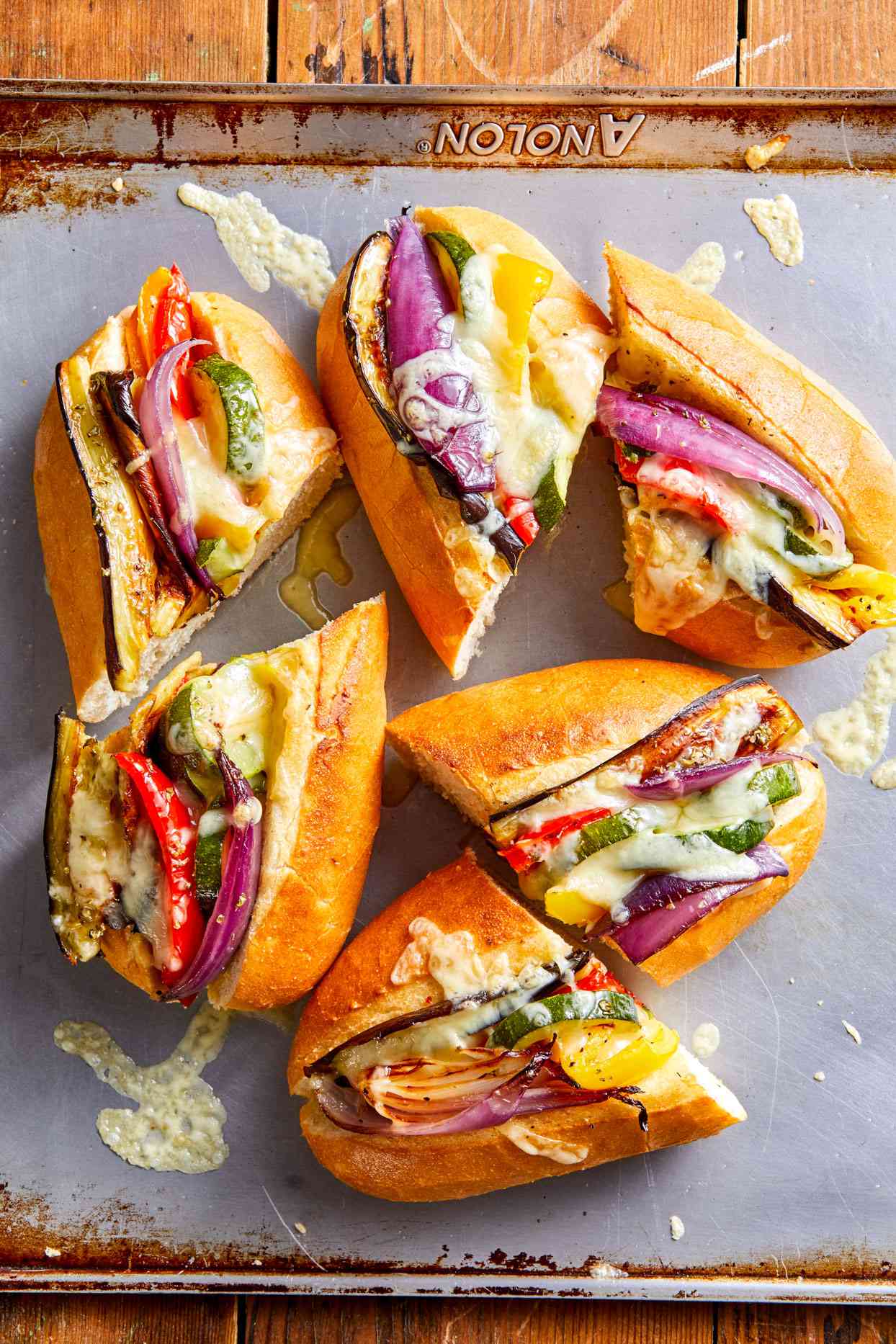 pan of Italian veggie heroes sandwiches cut in half
