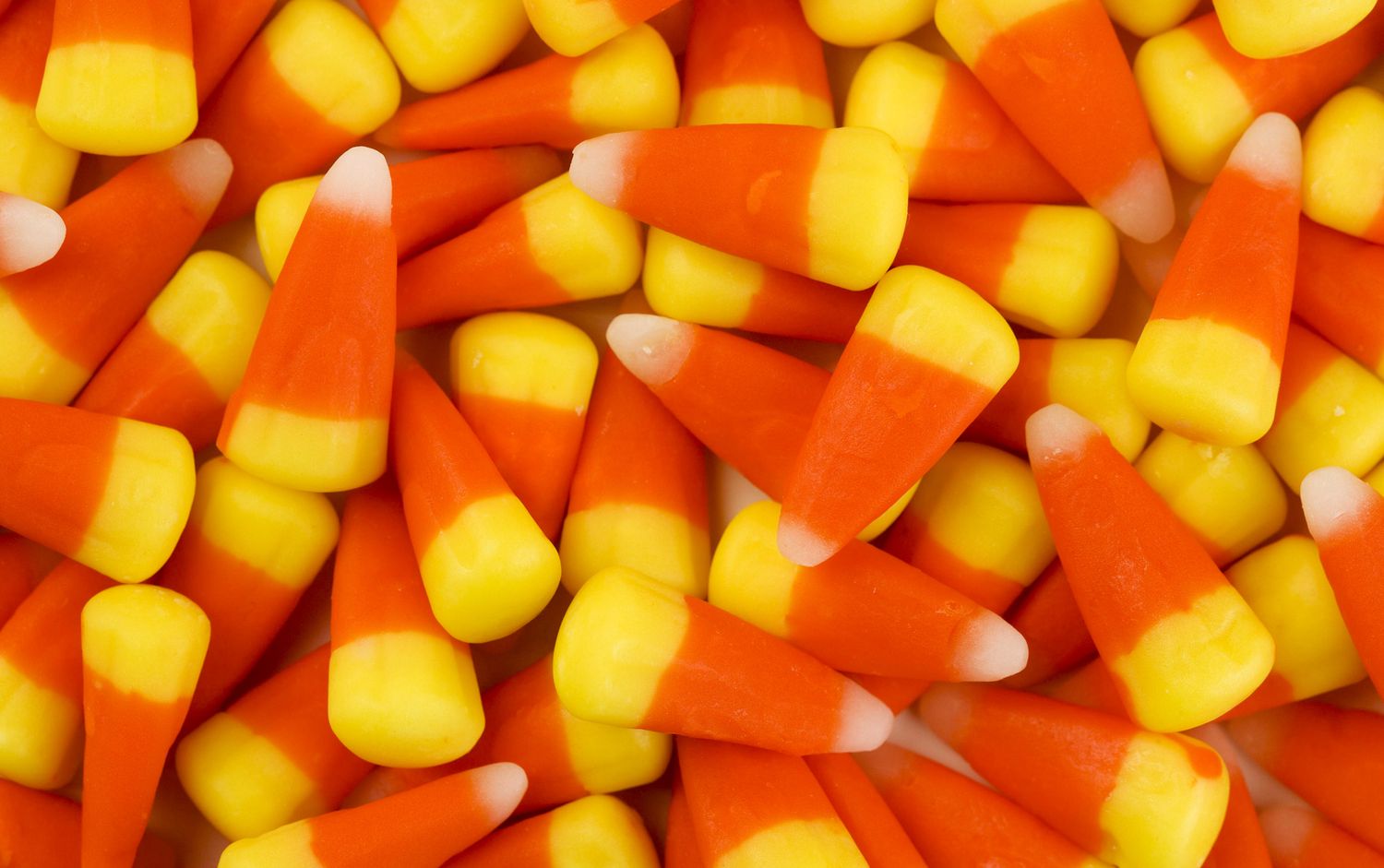 close up of multiple candy corn candies