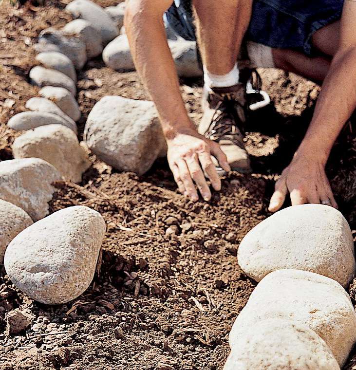 placing rocks for walkway