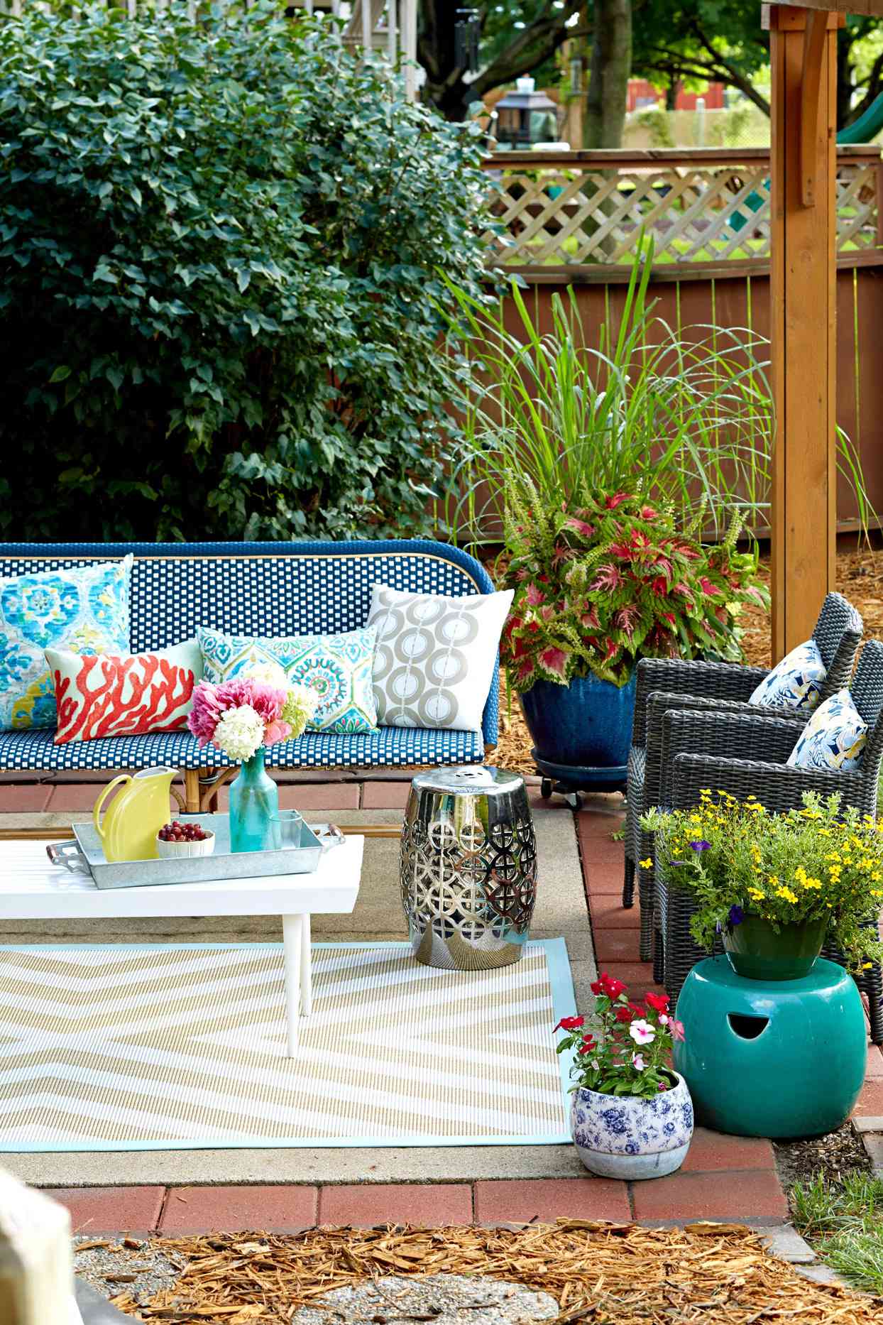 modern patio with blue bench and pillows
