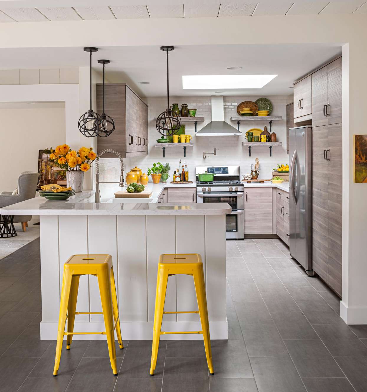 white kitchen with yellow chairs