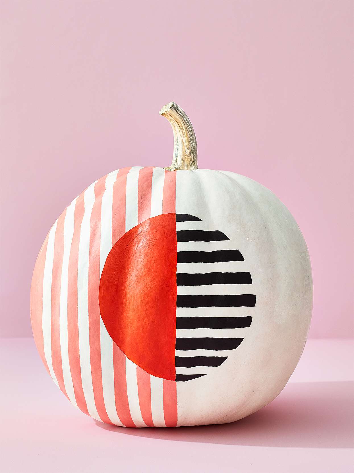 white pumpkin with painted stripes and colorblock circle