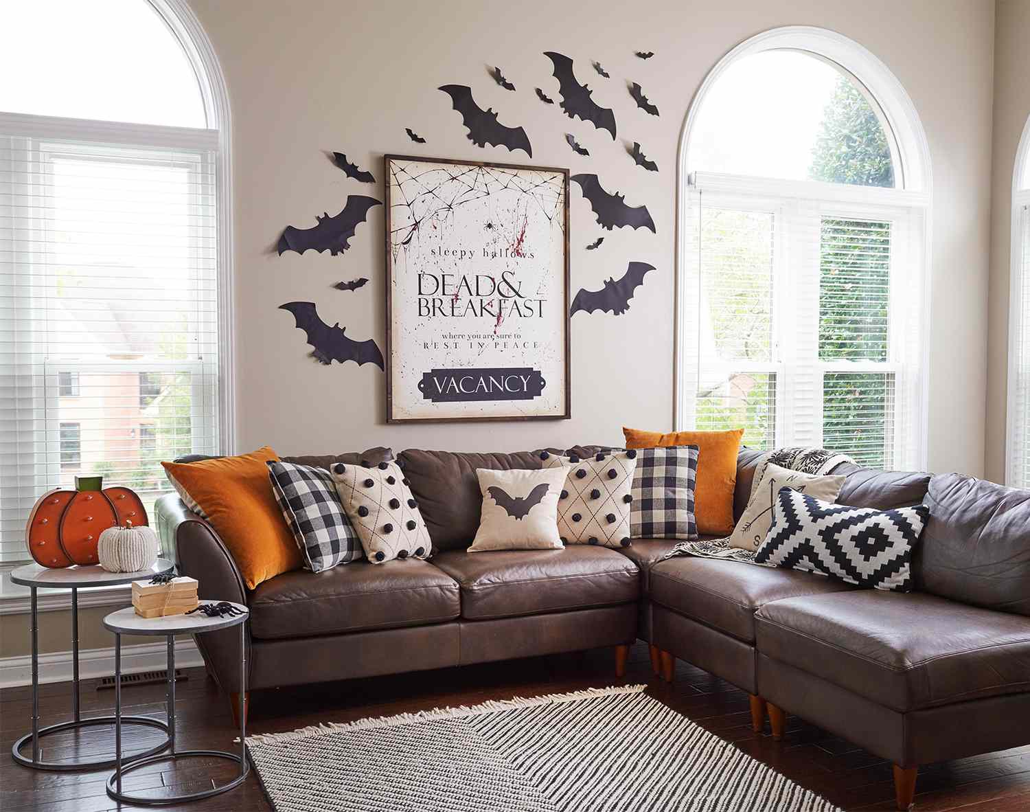 bat wall decor and pillows in living room