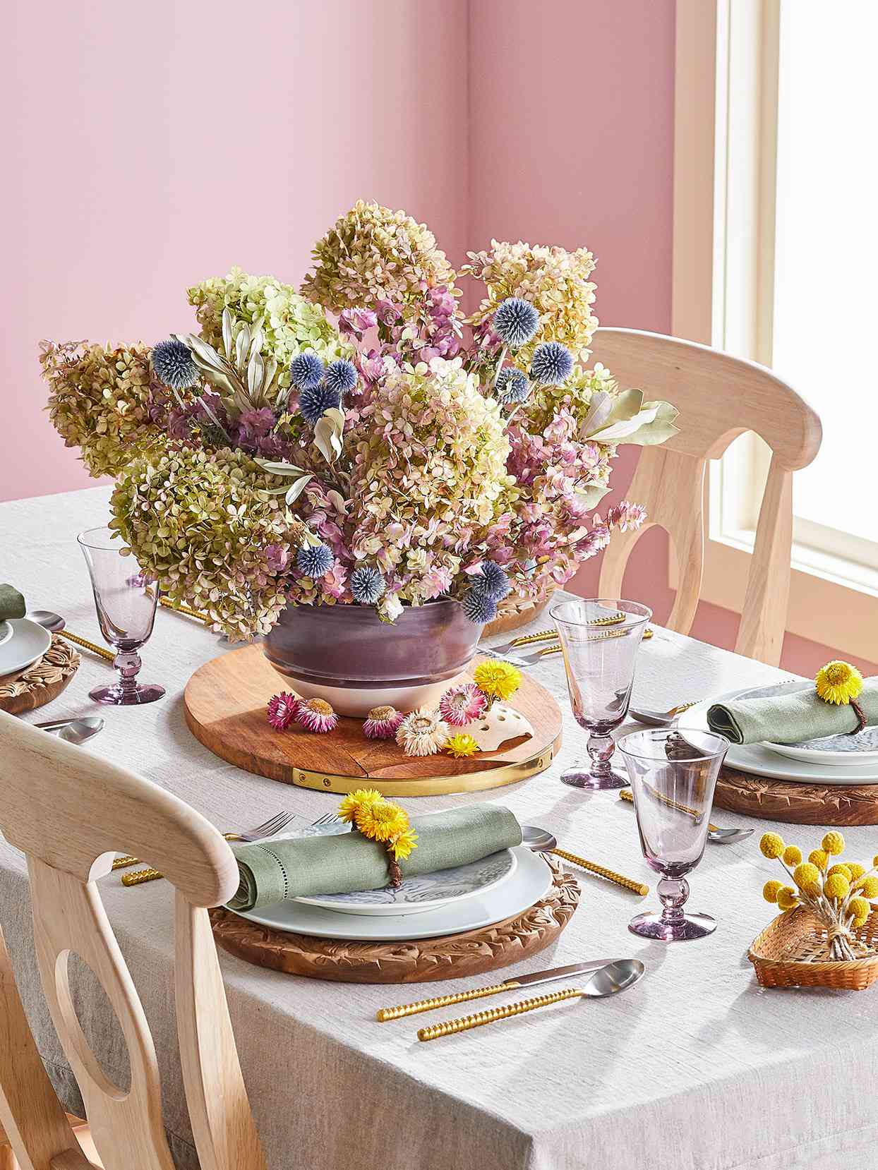pink dining table dried hydrangea globe thistle