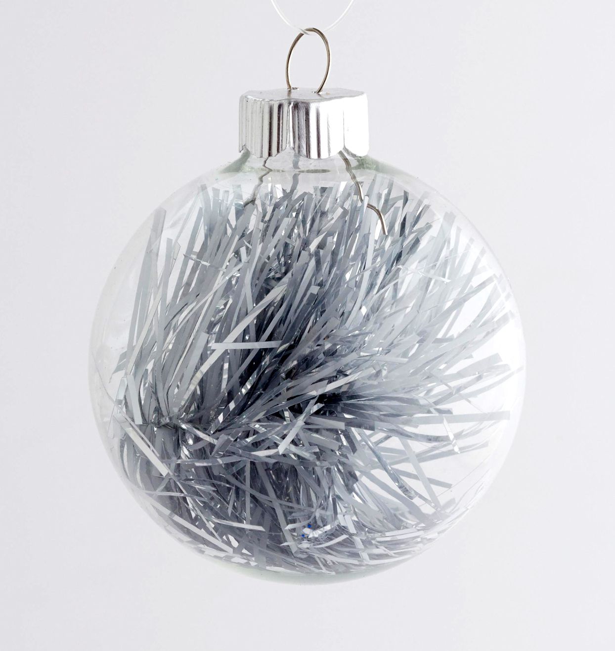 glass ornament with tinsel