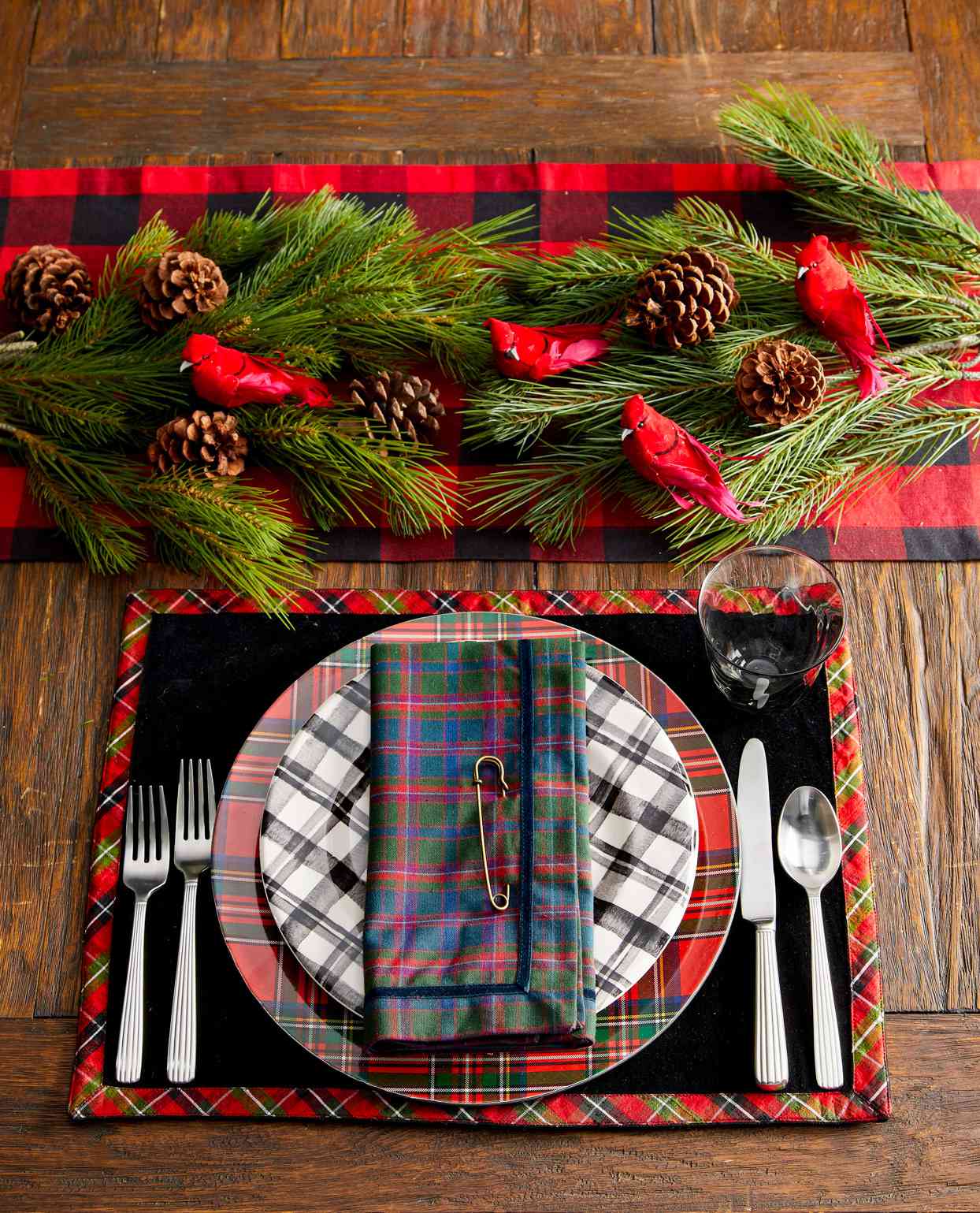 plaid christmas place setting with pine garland