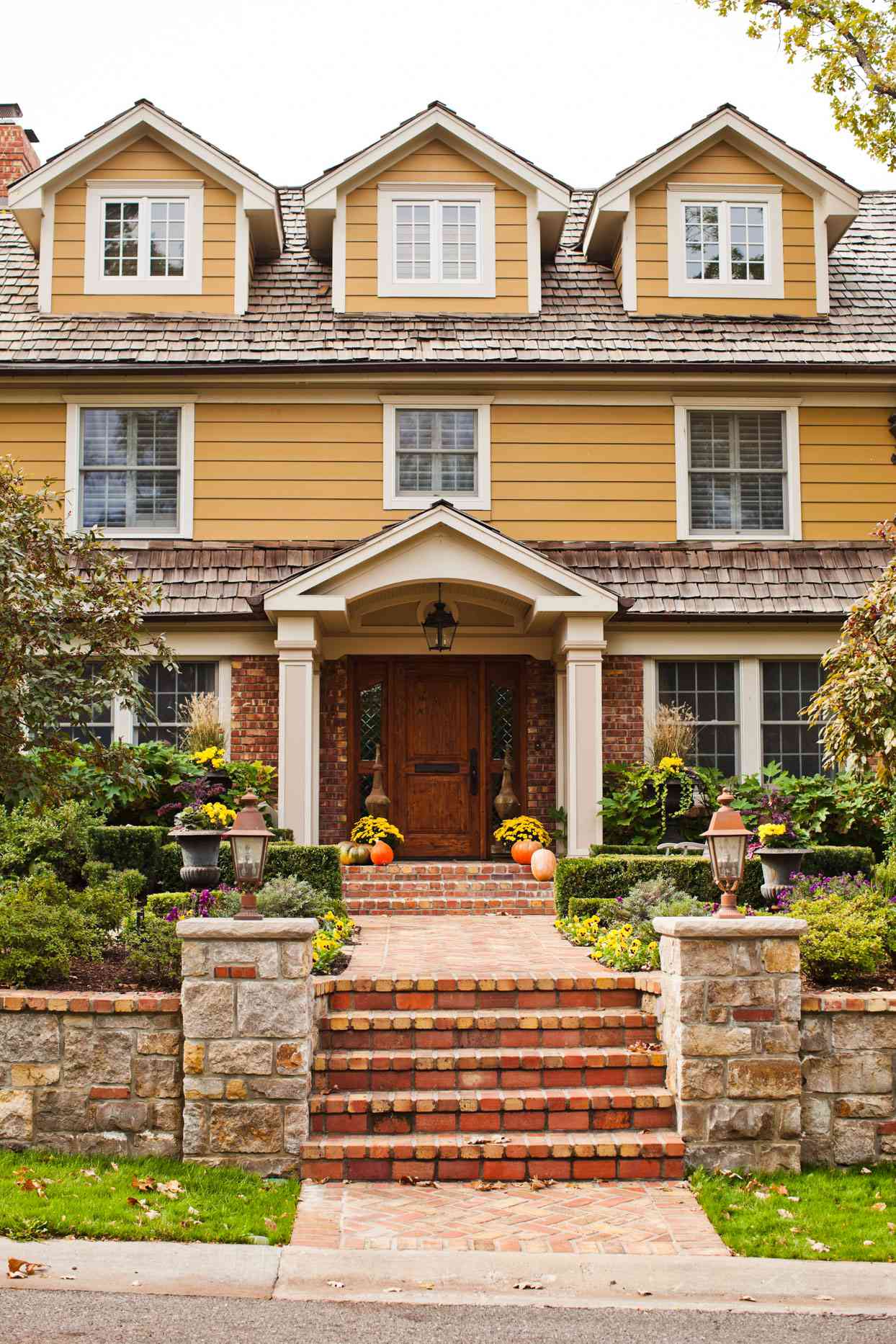 stone and yellow home exterior