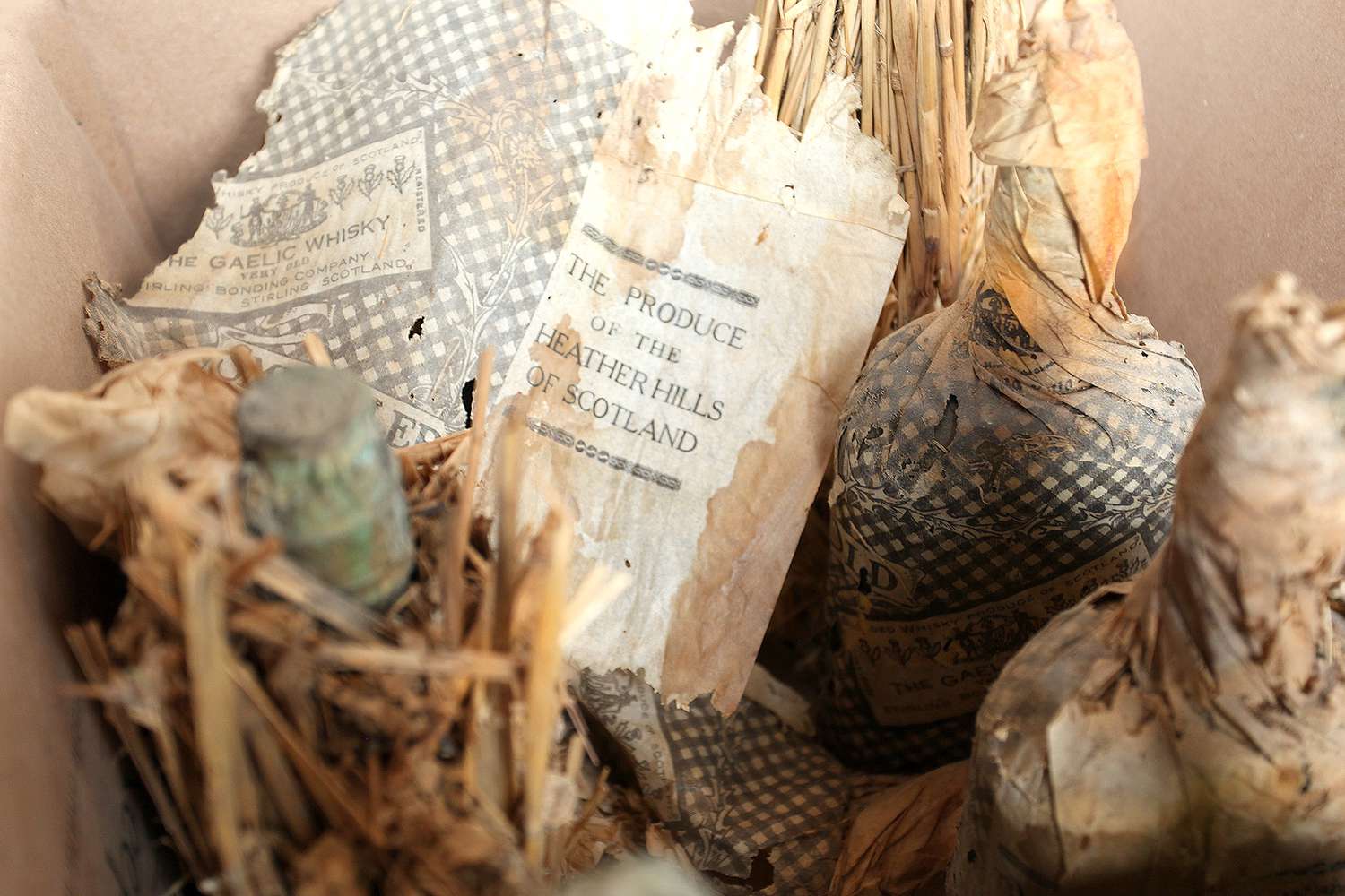 labels of wrapped prohibition-era Gaelic Old Smugglers whiskey bottles
