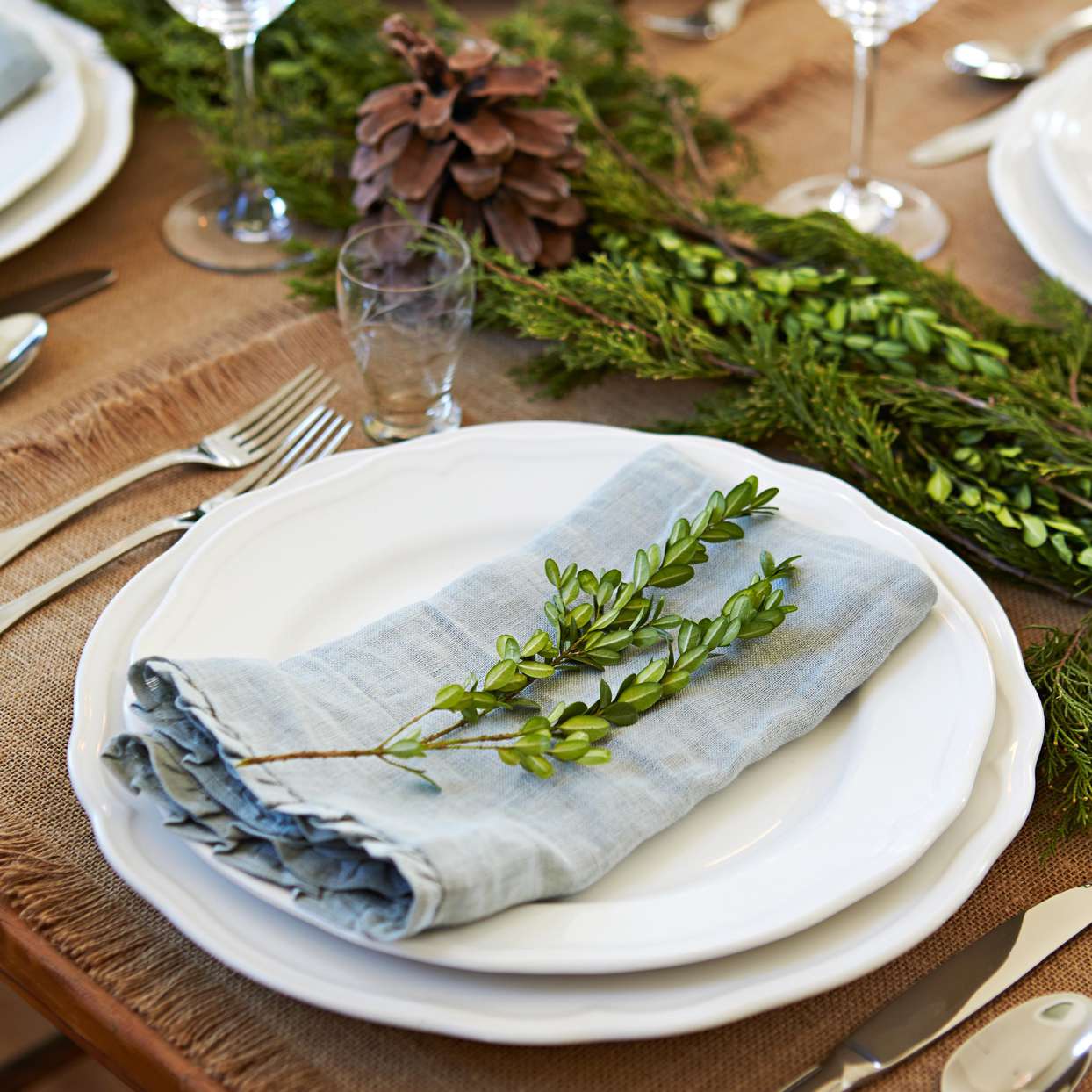 Elegant Linen and Greenery Place Setting