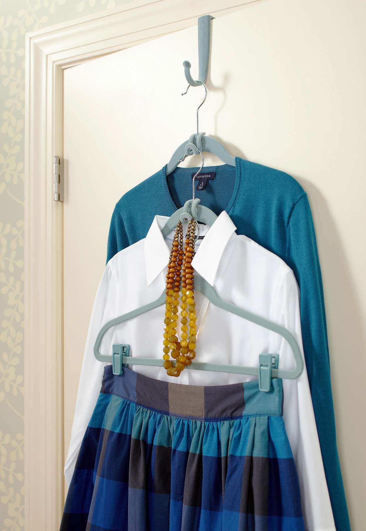 outfit displayed on hanging door hook