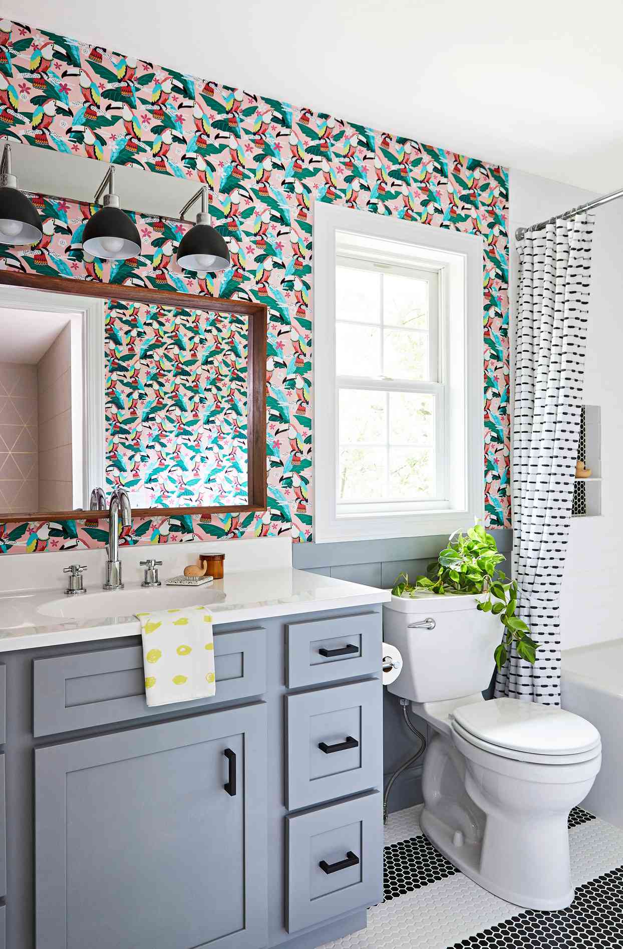 bathroom with toucan pattern wallpaper