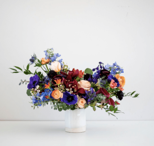 blue, purple, and red flower arrangement