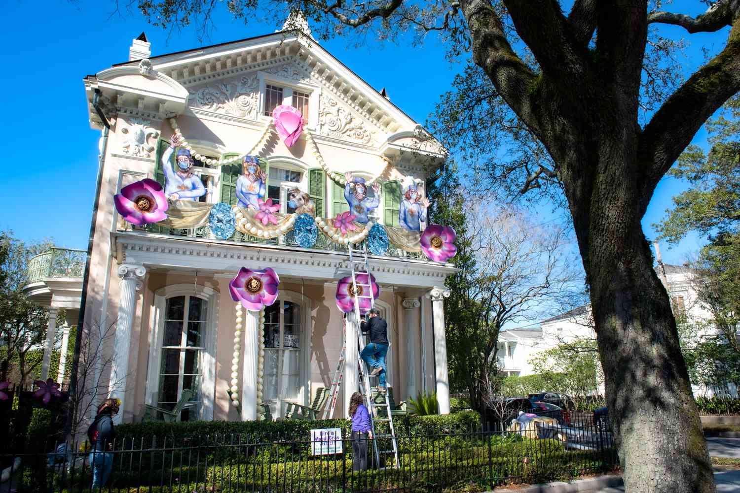 house with mardi gras decorations with ladder