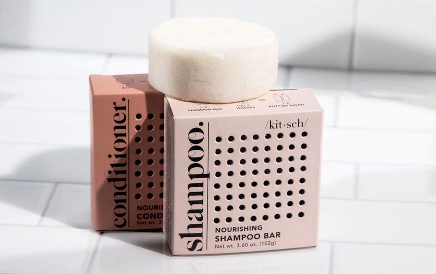 KITSCH brand shampoo and conditioner bars in a shower