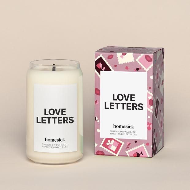 white candle that says love letters on the front