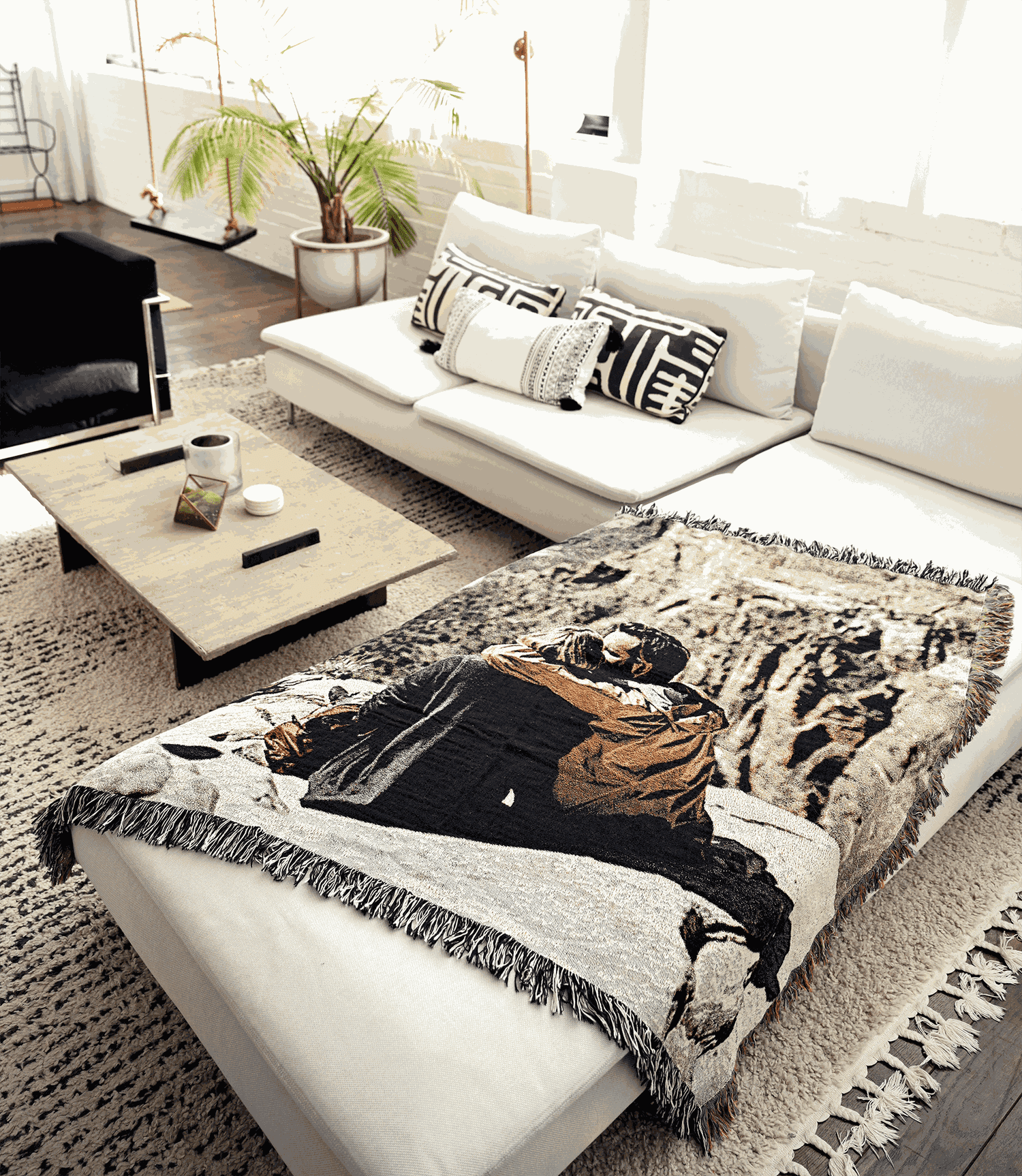 white couch with a photo blanket on it
