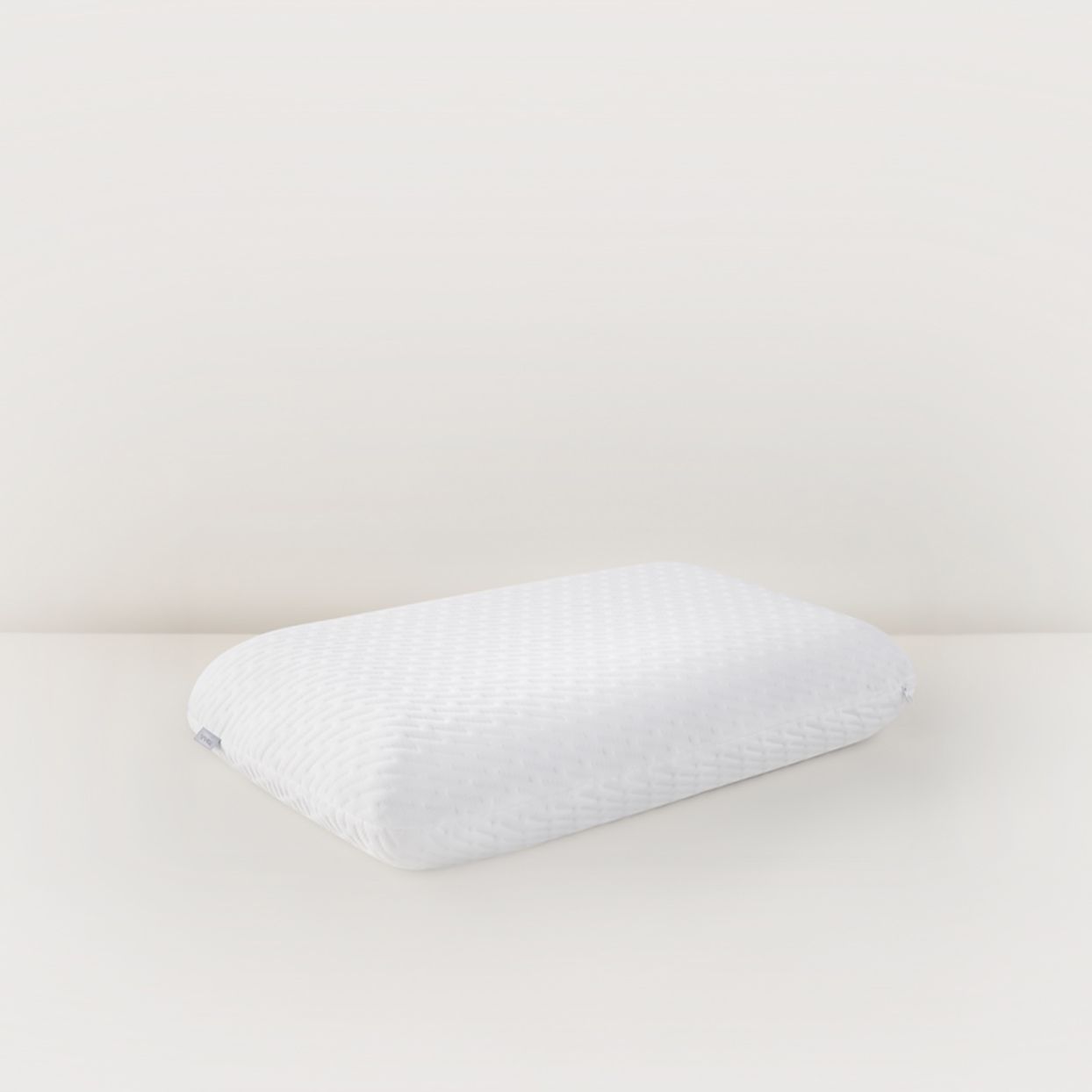 white pillow with textured cover
