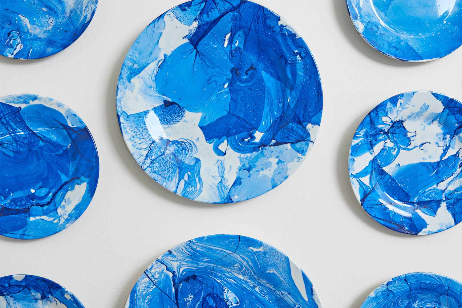 close up of blue and white marbled plates