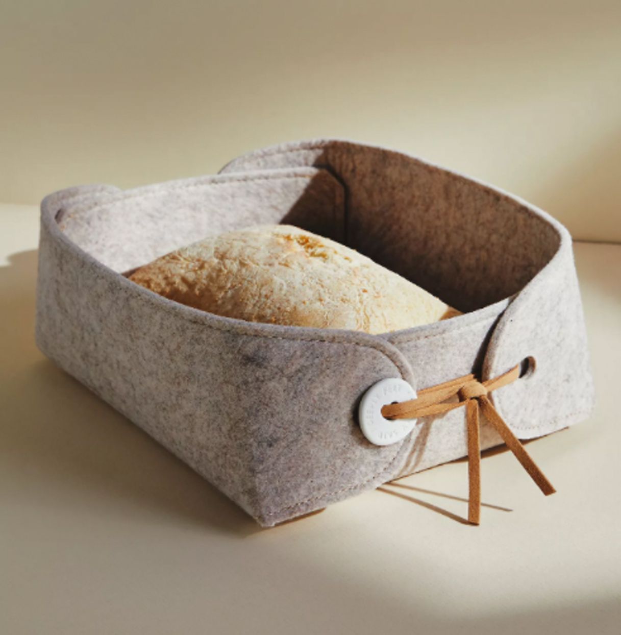 Grey bread basket with warming tile inside