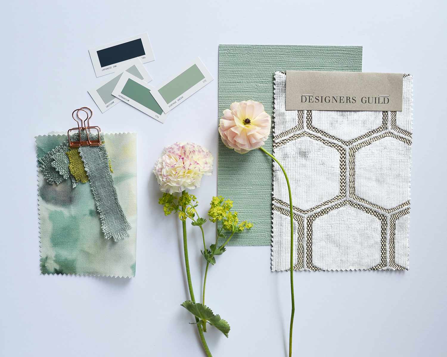 celadon mood board with fabric samples and paint chips