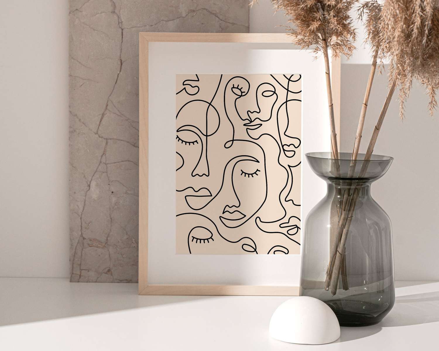 framed line art print with neutral tabletop decor