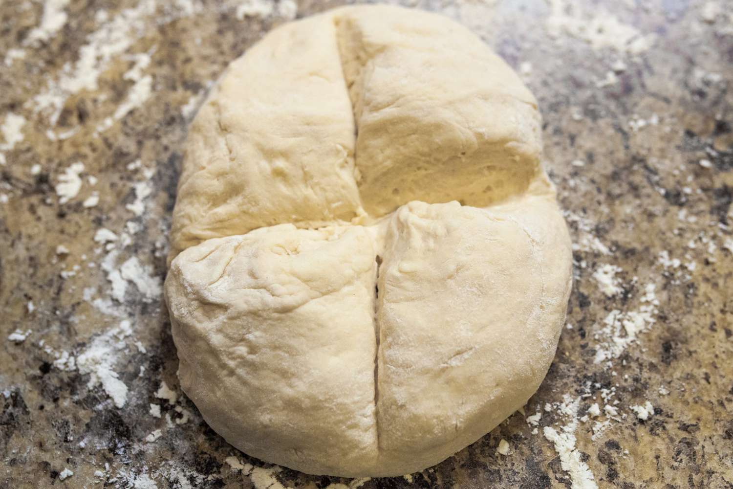 ball of dough with X cut in