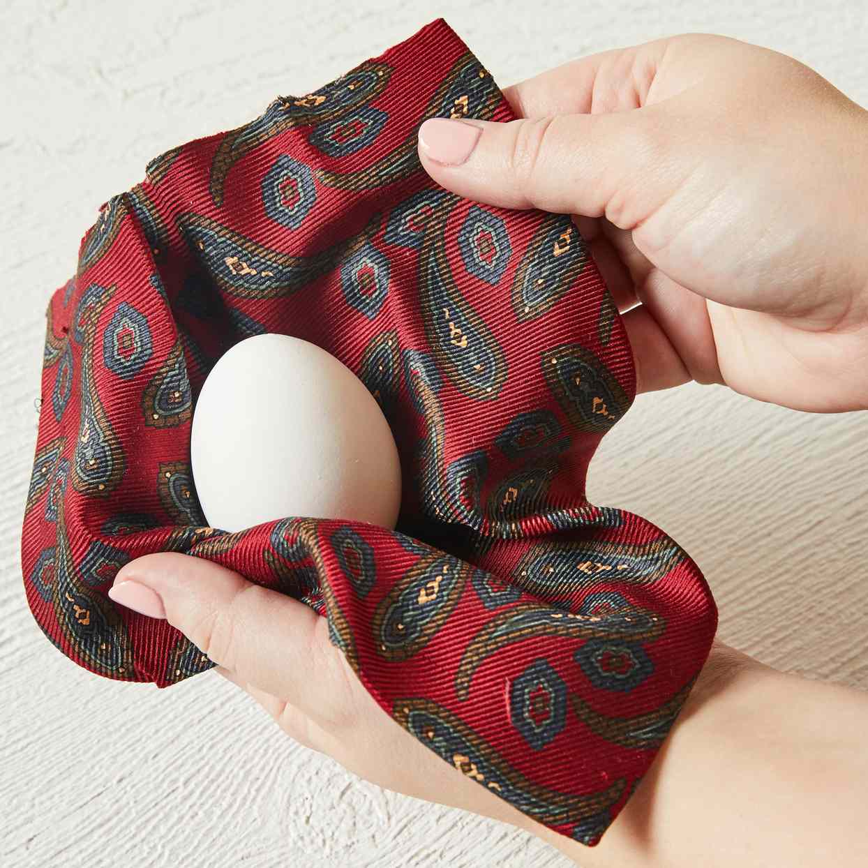 wrapping egg in handkerchief