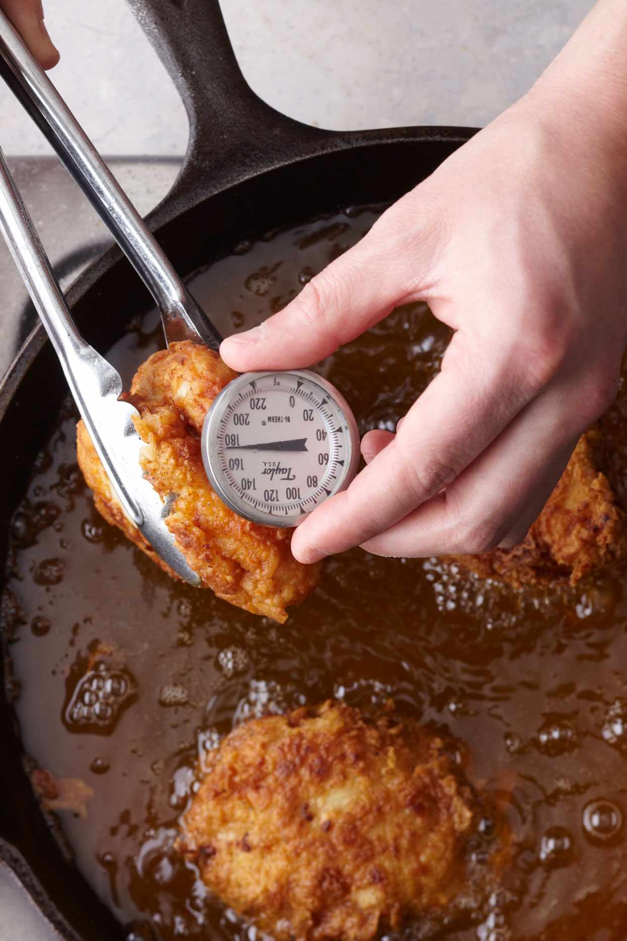 checking fried chicken temperature