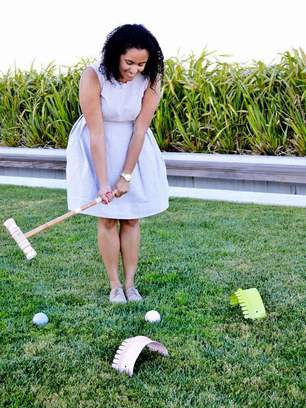 woman playing croquet