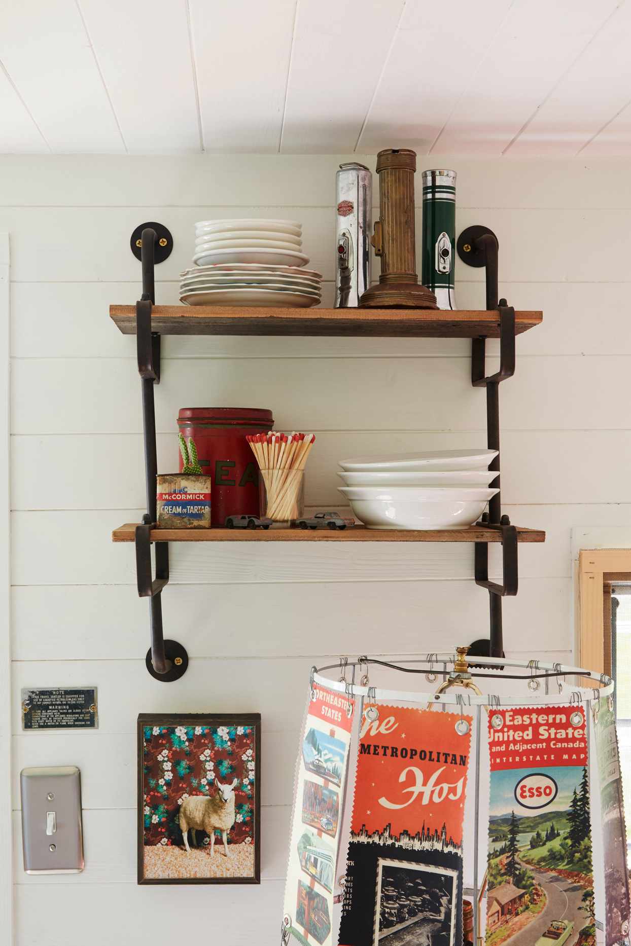 open shelving with plates and decorative accents